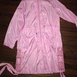 Pink hooded rain parka with side eyelet detail